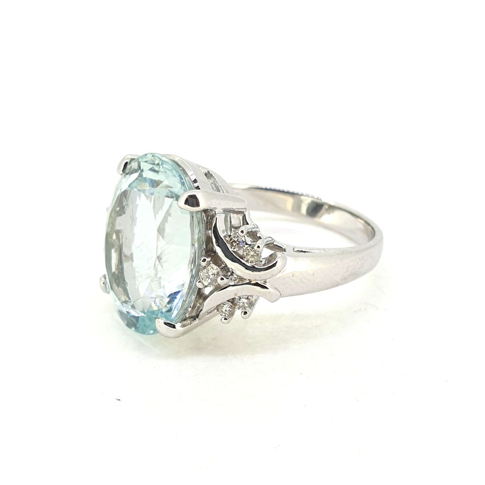 8.58ct Oval Aquamarine Solitaire Ring with Diamond Shoulders, large single stone oval mixed-cut aquamarine in 18ct white gold with decorative swirled shoulders accented with round brilliant-cut diamonds