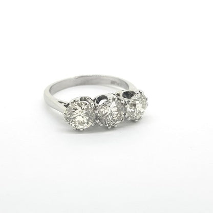 Diamond Three Stone Ring in Platinum; classic diamond trilogy ring with three round brilliant-cut diamonds totalling 2.15 carats