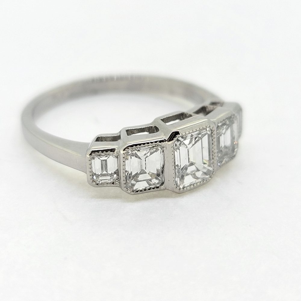 Emerald Cut Diamond Five Stone Engagement Ring in Platinum, 1.75 carats five graduating emerald cut diamonds in rub-over setting