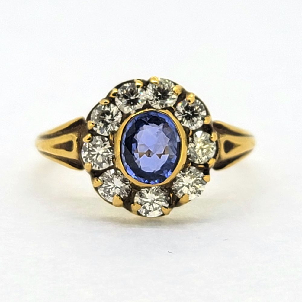 Antique Style 0.80ct Oval Sapphire and Diamond Cluster Engagement Ring in 18ct Yellow Gold