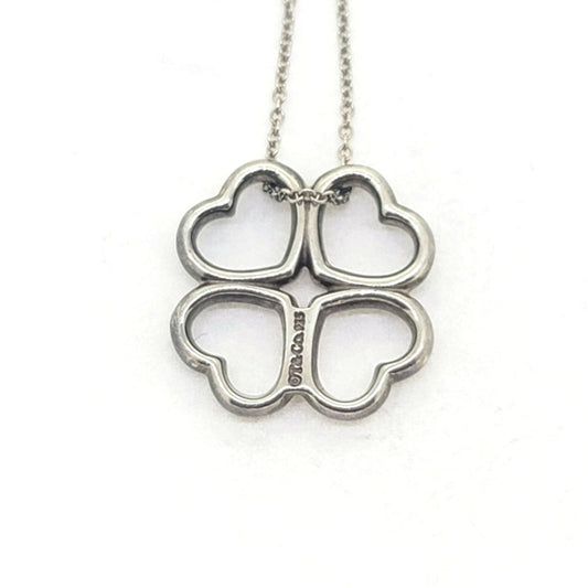 Vintage Tiffany and Co Loving Hearts Silver Pendant with Chain, composed of four loving hearts suspended on a silver chain