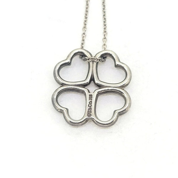Vintage Tiffany and Co Loving Hearts Silver Pendant with Chain, composed of four loving hearts suspended on a silver chain