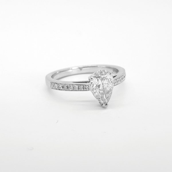 Pear Shaped Diamond Cluster Engagement Ring; central 1.08ct pear-cut diamond within a diamond surround, accented with diamond set shoulders, in 18ct white gold