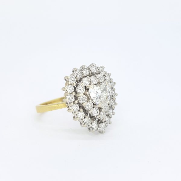 Vintage Diamond Heart Shaped Cluster Ring; central 0.70ct heart-shaped diamond surrounded by two borders of brilliant-cut diamonds totalling 1.00ct, in 18ct gold