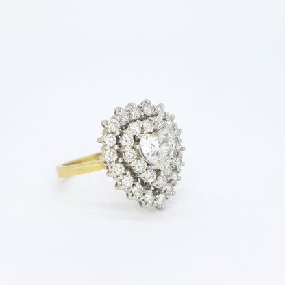 Vintage Diamond Heart Shaped Cluster Ring; central 0.70ct heart-shaped diamond surrounded by two borders of brilliant-cut diamonds totalling 1.00ct, in 18ct gold