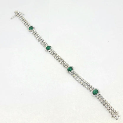 2.24ct Emerald and 3.45ct Diamond Bracelet, double row of sparkling diamonds interspersed with emerald and diamond cluster accents in 18ct white gold