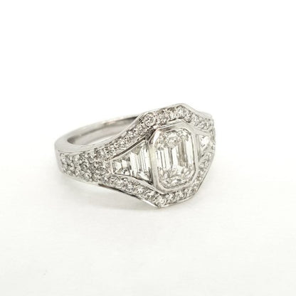 Contemporary Emerald Cut Diamond Cluster Ring; central GIA certified 1.22ct emerald-cut diamond is surrounded by brilliant and baguette-cut diamonds, in 18ct white gold, F colour, SI1 clarity