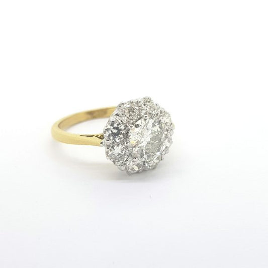 Old Cut Diamond Cluster Ring; central 1ct old-cut diamond encompassed within an old cut diamond surround, 2.00 carat total, in 18ct yellow gold