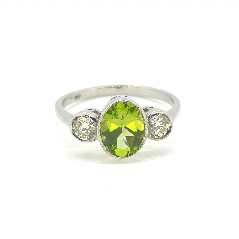 1.25ct Oval Peridot and Diamond Three Stone Ring