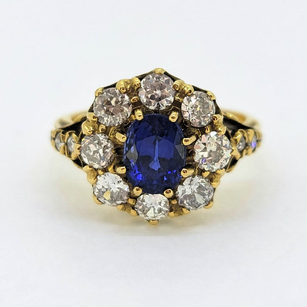 Antique Style 1.70ct Sapphire and Diamond Cluster Engagement Ring, 1.50ct oval cut sapphire surrounded by 1.40cts diamonds in crown cluster setting in 18ct yellow gold