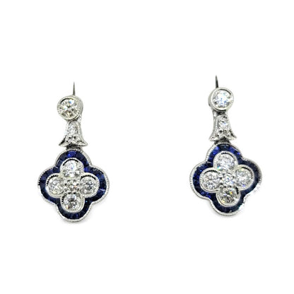 Diamond and Sapphire Quatrefoil Cluster Drop Earrings, Diamonds arranged in a quatrefoil design surrounded by calibre sapphire border with diamond stud tops