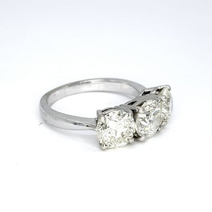 Diamond Three Stone Ring in 18ct White Gold, 3.73 carat total, central 1.30 carat round brilliant-cut diamond flanked by diamonds totalling an additional 2.43 carats