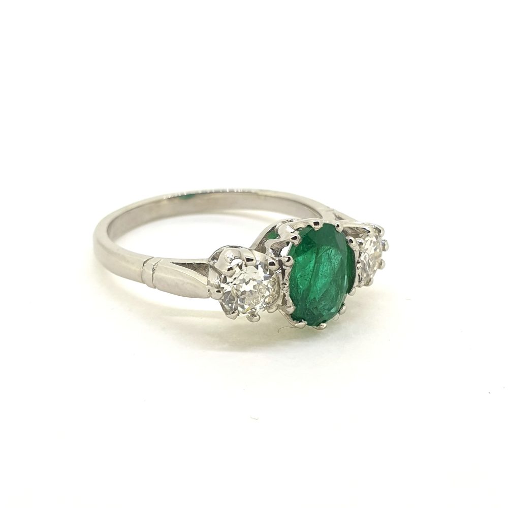 1.30ct Oval Emerald and Diamond Three Stone Engagement Ring in Platinum