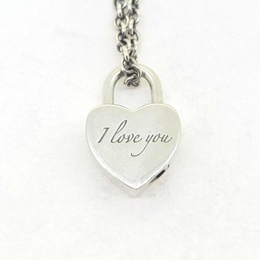Vintage Tiffany and Co Silver Heart Padlock Charm Pendant with Chain, opening heart padlock charm engraved with 'I Iove You' on one side on a silver chain