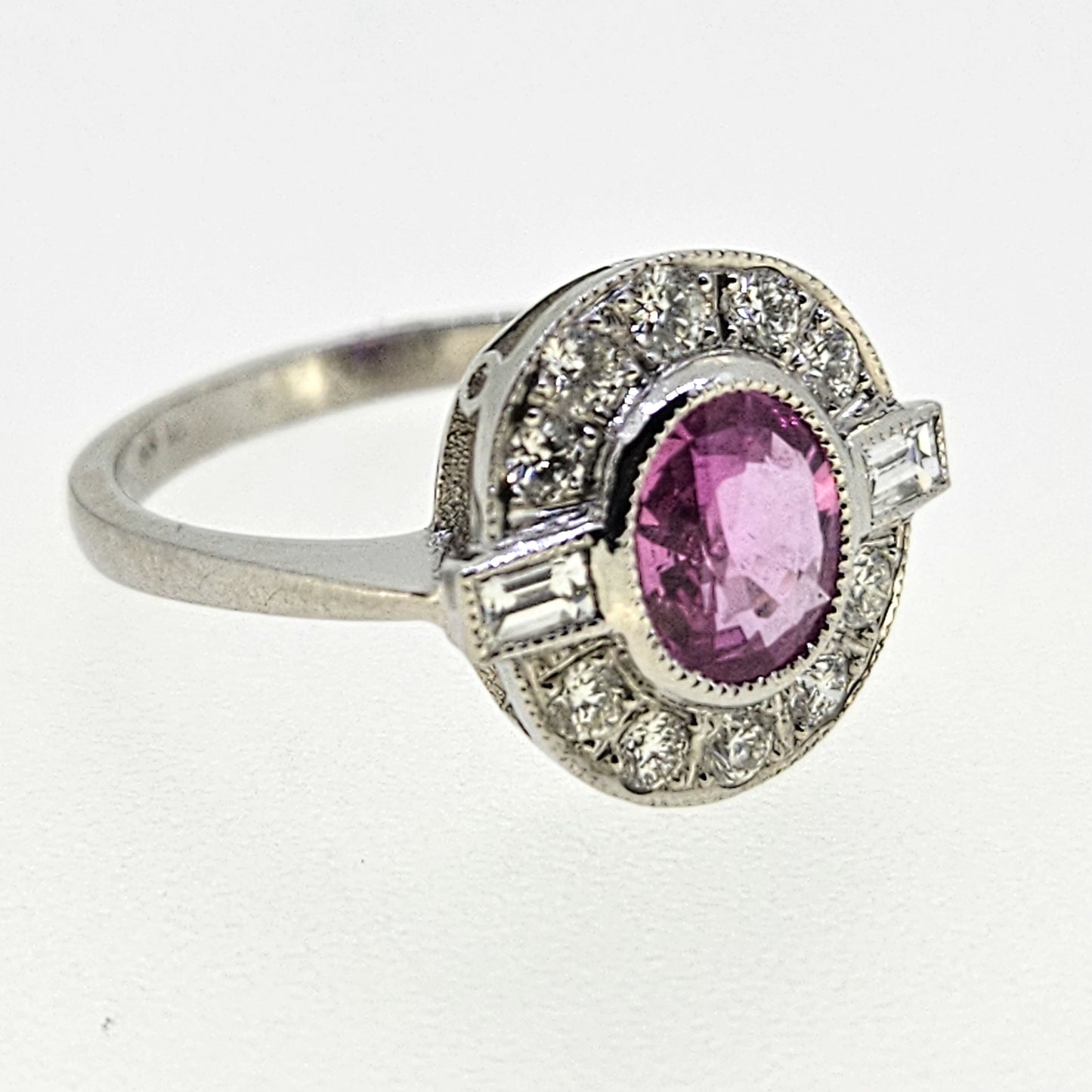 1.20ct oval pink sapphire ring with diamonds in platinum
