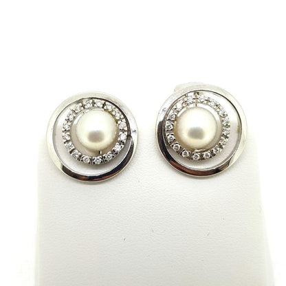 Contemporary Pearl and Diamond Halo Cluster Earrings; central pearls within diamond halos and surrounded by an outer 14ct white gold border