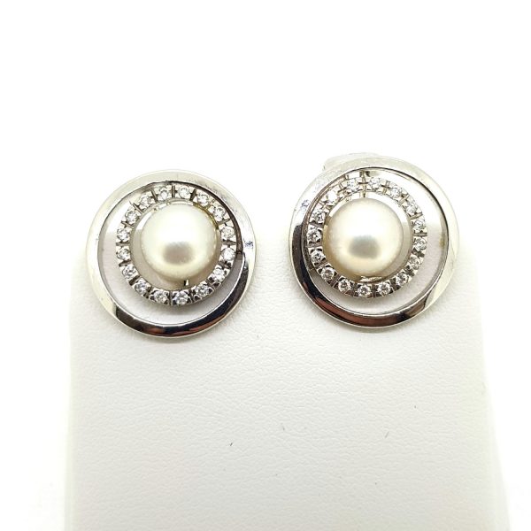 Contemporary Pearl and Diamond Halo Cluster Earrings; central pearls within diamond halos and surrounded by an outer 14ct white gold border