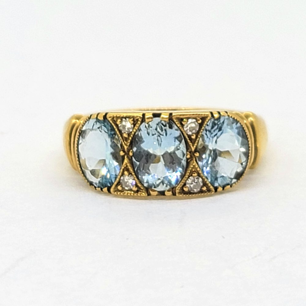 Aquamarine Three Stone Ring in 18ct Yellow Gold with Diamond Accents