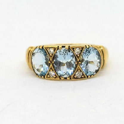 Aquamarine Three Stone Ring in 18ct Yellow Gold with Diamond Accents