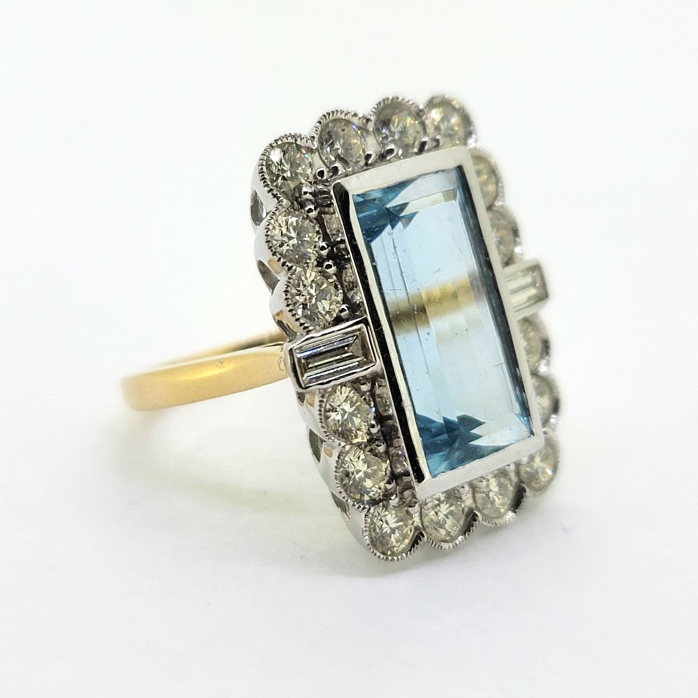 6.50ct Aquamarine and Diamond Floral Cluster Dress Ring, rectangular step-cut aquamarine surrounded by 2cts round brilliant-cut and baguette-cut diamonds in 18ct white and yellow gold