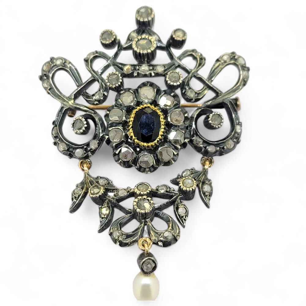 Victorian Antique Rose Cut Diamond and Sapphire Brooch in Silver, central blue sapphire surrounded by rose-cut diamonds suspending a pearl pendant drop
