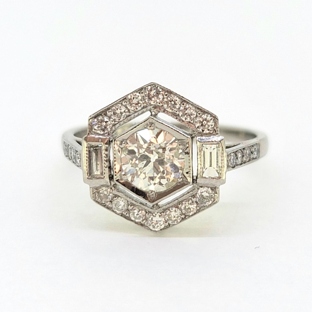 Hexagonal Diamond Cluster Engagement Ring in Platinum, 1.15 carats, 0.75ct diamond surrounded by fixed border of brilliant-cut diamonds with baguette-cut diamonds to each side