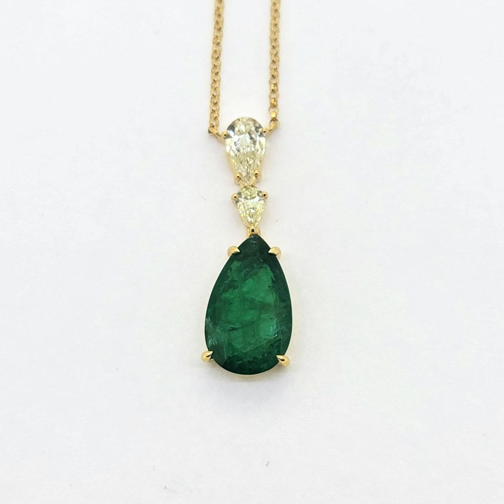 8ct Pear Cut Emerald and Diamond Drop Pendant Necklace, 8.04ct pear shaped emerald and double diamond pendant suspended on fixed chain in 18ct yellow gold
