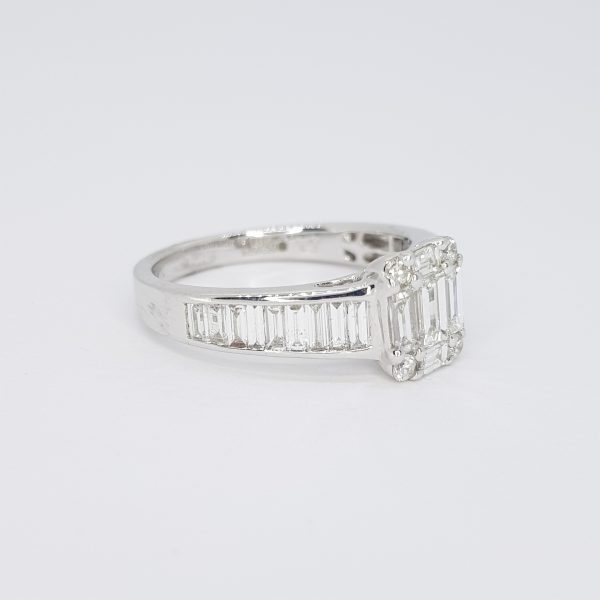 Illusion Set Baguette Cut Diamond Ring; the top claw-set with baguette and brilliant-cut diamonds, channel-set baguette-cut diamond shoulders, 1.02 carat total, in 18ct white gold