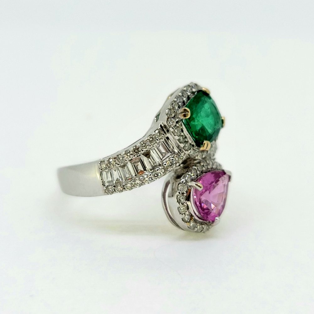 Contemporary 1.04ct Pear Cut Pink Sapphire 0.85ct Emerald and 0.77ct Diamond Cluster Toi et Moi Two Stone Crossover Ring in 18ct White Gold