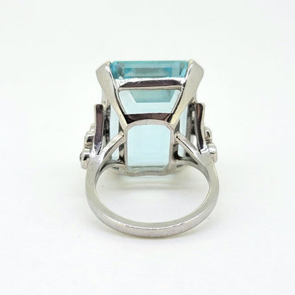 30ct Emerald Cut Aquamarine Cocktail Ring with Diamonds, large 30ct emerald-shaped step-cut aquamarine accented with sparkling diamonds to the shoulders in 18ct white gold