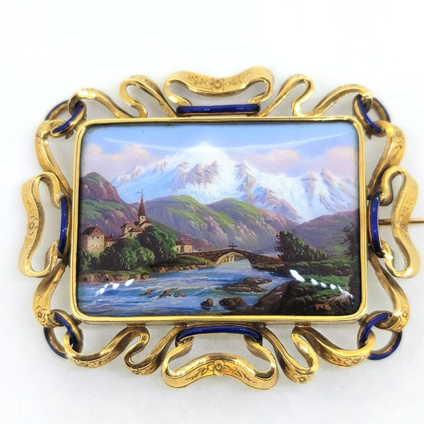 Swiss Enamel Brooch in Decorative Gold Frame, Swiss enamel scenery single pin brooch inside detailed ribbon of gold accented with hints of blue enamel