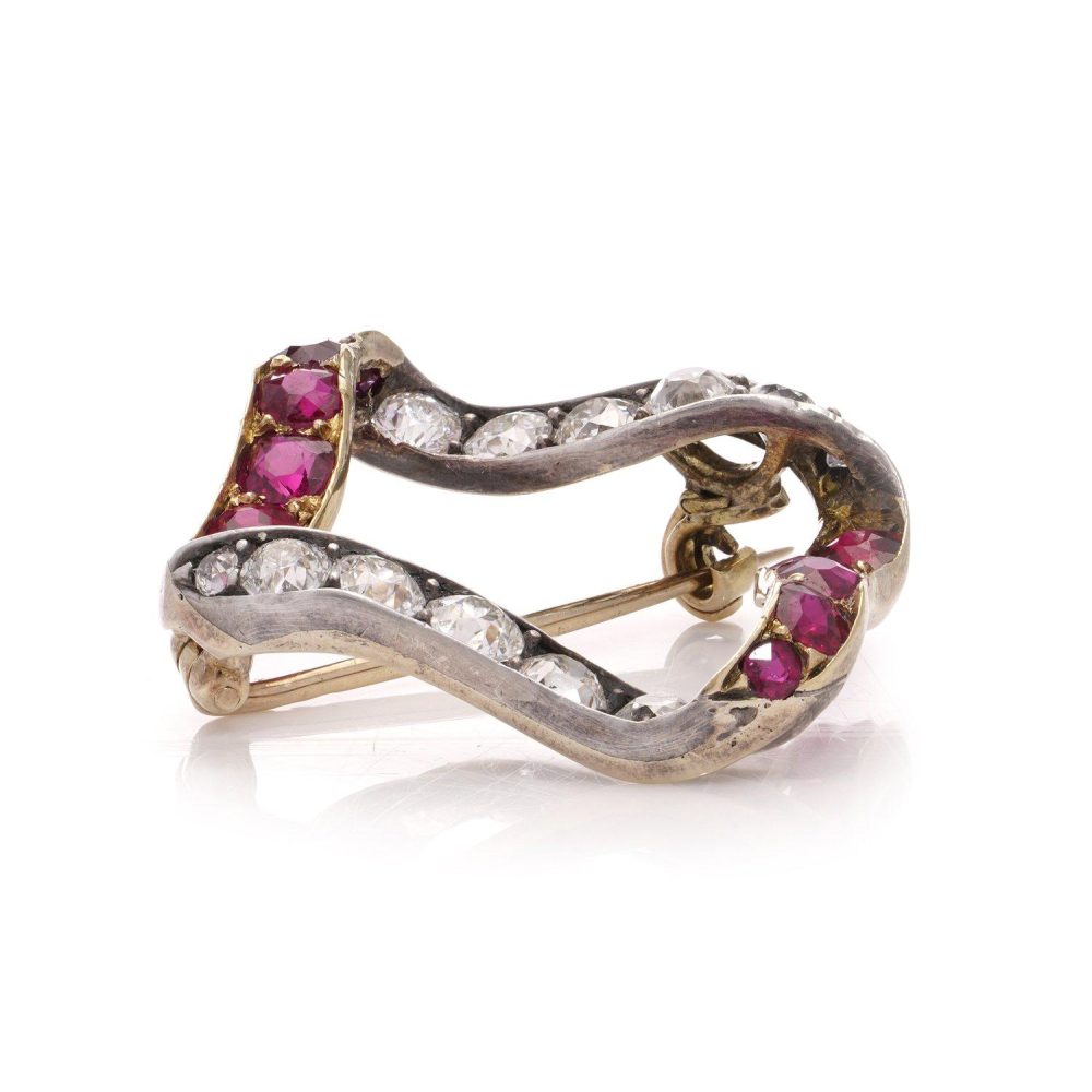 Late Victorian Antique Burma Ruby and Old Cut Diamond Ribbon Brooch, late Victorian 15ct gold ribbon brooch set with Burma rubies and old European-cut diamonds. Circa 1900