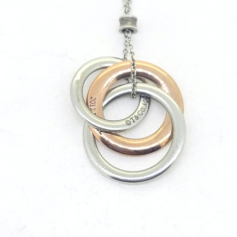 Vintage Tiffany and Co Interlocking Circles Pendant Circa 2012, bi-colour 925 silver and rubedo triple interlocking circle pendant and chain by Tiffany & Co from the 1837 Rubedo collection