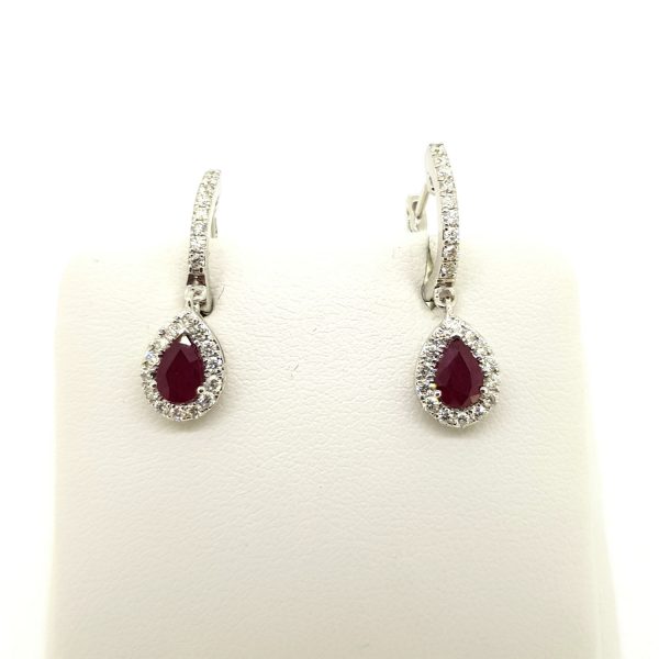 Ruby and Diamond Cluster Drop Earrings; featuring 1.02ct rubies within diamond surrounds and suspended from diamond-set drops, in 18ct white gold