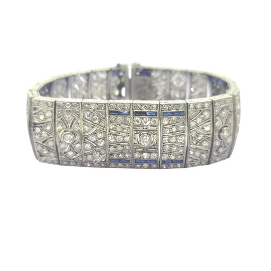 Art Deco Sapphire and Diamond Bracelet in Platinum, wide platinum bracelet set with sparkling diamonds accented with rich blue sapphires Circa 1920s 1930s