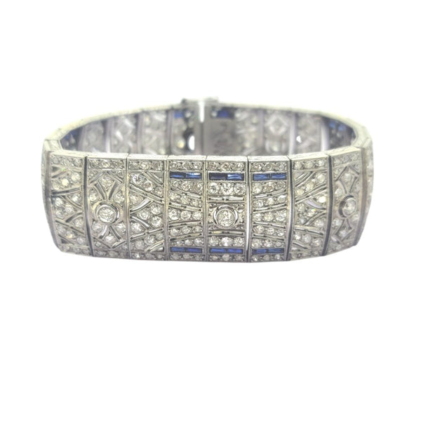 Art Deco Sapphire and Diamond Bracelet in Platinum, wide platinum bracelet set with sparkling diamonds accented with rich blue sapphires Circa 1920s 1930s