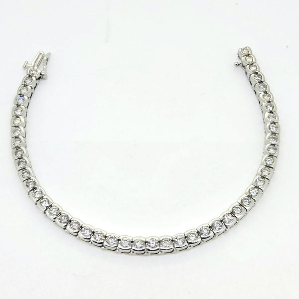 Modern 6.60ct Diamond Line Bracelet in 14ct White Gold, 6.60 carats of round brilliant-cut diamonds in individual bezel settings creating a seamless articulated design