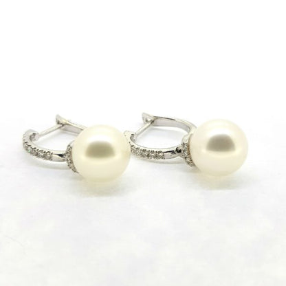 Freshwater Pearl and Diamond Drop Earrings; featuring 9.5mm freshwater pearls suspended via 0.41cts diamond-set drops