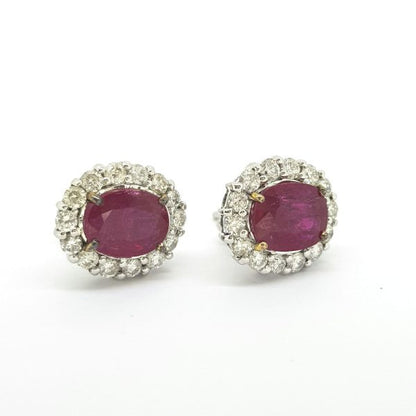 Ruby and Diamond Oval Cluster Stud Earrings; featuring 4.65cts oval faceted rubies surrounded by 1.48cts diamonds, in 18ct white gold