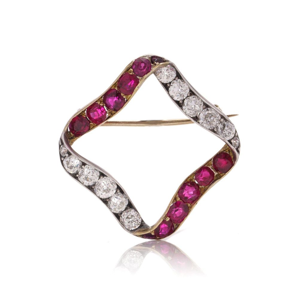 Late Victorian Antique Burma Ruby and Old Cut Diamond Ribbon Brooch, late Victorian 15ct gold ribbon brooch set with Burma rubies and old European-cut diamonds. Circa 1900