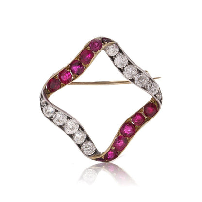 Late Victorian Antique Burma Ruby and Old Cut Diamond Ribbon Brooch, late Victorian 15ct gold ribbon brooch set with Burma rubies and old European-cut diamonds. Circa 1900
