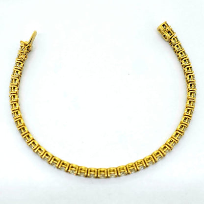 10.42ct Diamond Line Tennis Bracelet in Yellow Gold, composed of 44 round brilliant-cut diamonds totalling 10.42 carats each in individual claw settings in 18ct yellow gold