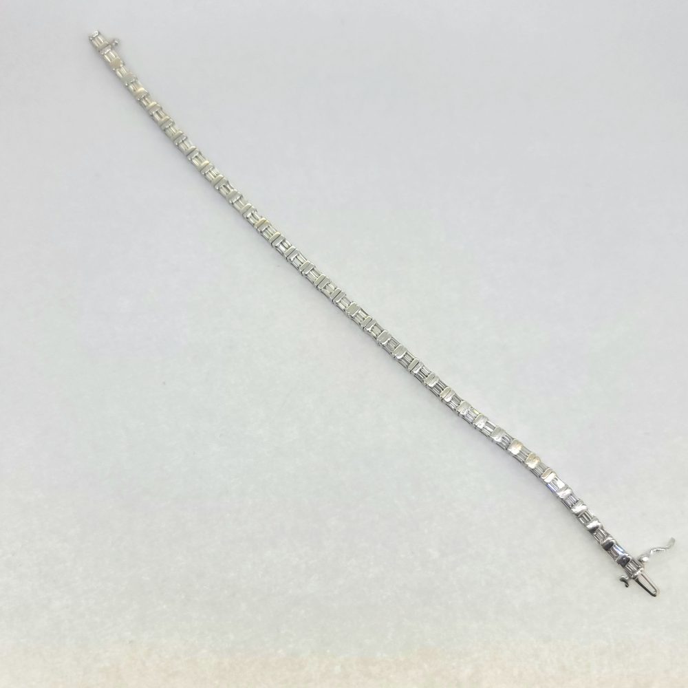 Vintage 4.50ct Baguette Cut Diamond Line Tennis Bracelet, 37 links each set with two baguette-cut diamonds in 18ct White Gold