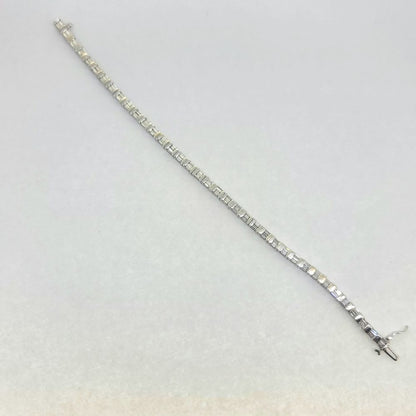 Vintage 4.50ct Baguette Cut Diamond Line Tennis Bracelet, 37 links each set with two baguette-cut diamonds in 18ct White Gold