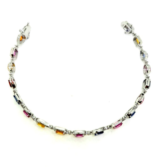Multi Colour Sapphire and Diamond Cluster Line Bracelet, 18 eighteen mixed cut multi coloured sapphires surrounded by diamonds in 18ct white gold. Sapphires 7.72 carats. Diamonds 1.25 carats