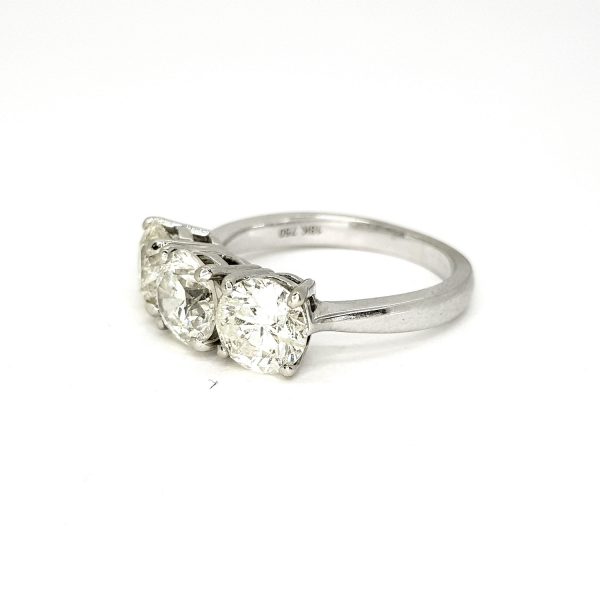 Diamond Three Stone Ring in 18ct White Gold, 3.73 carat total, central 1.30 carat round brilliant-cut diamond flanked by diamonds totalling an additional 2.43 carats