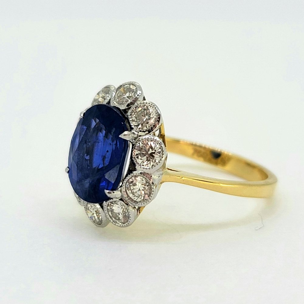 4.62ct Oval Sapphire and Diamond Cluster Engagement Ring