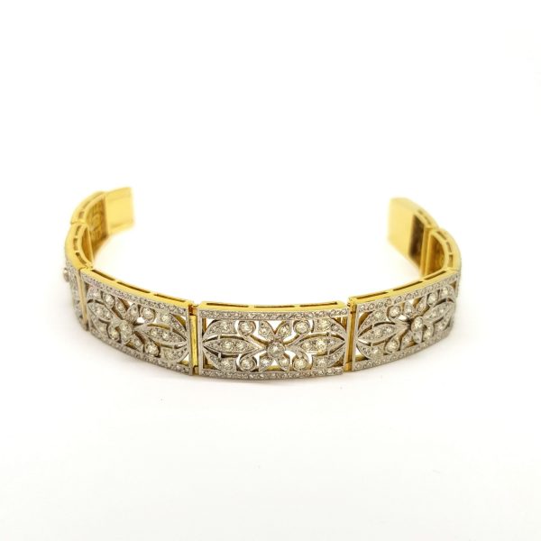 Art Deco Old Cut Diamond Decorative Panel Bracelet; comprised of seven decorative old cut diamond set openwork panels, 5.00 carat total, in platinum and 18ct yellow gold, Circa 1930s
