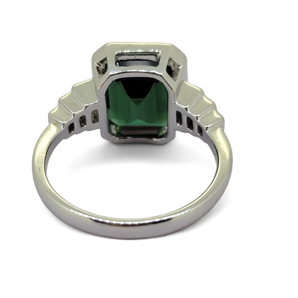Green Garnet and Diamond Engagement Ring, 4.86ct emerald-cut green garnet accented with graduated stepped diamond shoulders in 18ct white gold
