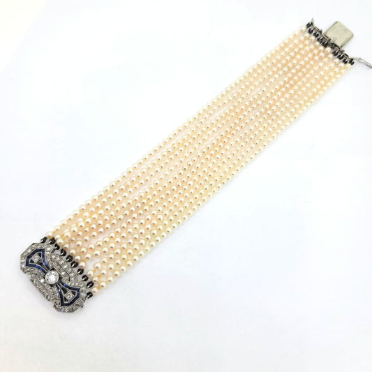 Art Deco Multi Strand Pearl Bracelet with Diamond and Sapphire Clasp, ten strands of well-matched cultured Akoya pearls with sapphire and diamond clasp